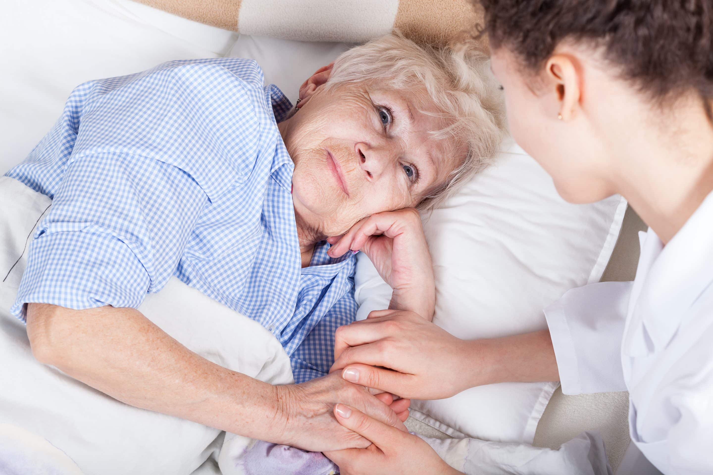 Elderly,Woman,In,Bed,And,Her,Nurse